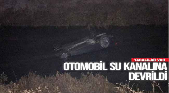 OTOMOBİL SU KANALINA DEVRİLDİ
